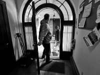 Veterans exit the front door with a bag in hand as he prepares to head home for the weekend. The Veterans Transition House currently housed at the rectory of the now closed St. John church on County Street in New Bedford, MA. A new building is scheduled tol be constructed in 2019.   PHOTO PETER PEREIRA